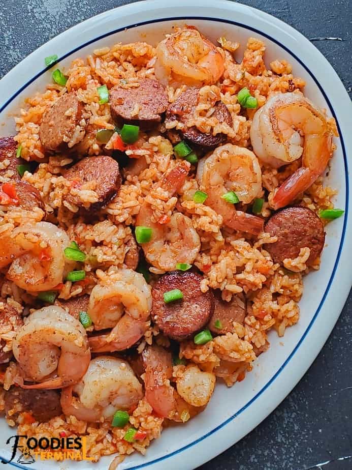 easy instant pot jambalaya with shrimp and sausage served in a white oval plate