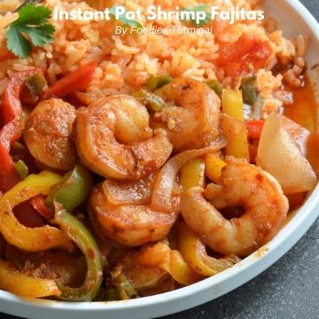 instant pot shrimp fajitas served with Mexican rice on a white plate