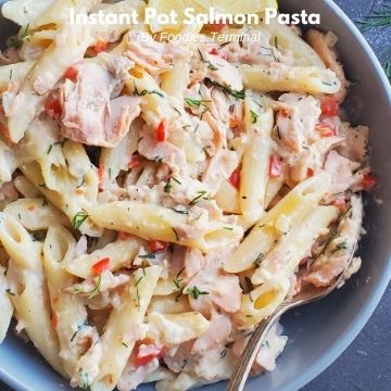 instant pot creamy salmon pasta served in a grey bowl with a spoon