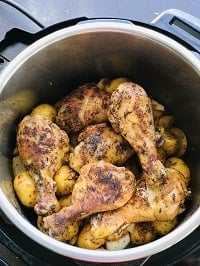 layered potatoes and chicken drumsticks in instant pot