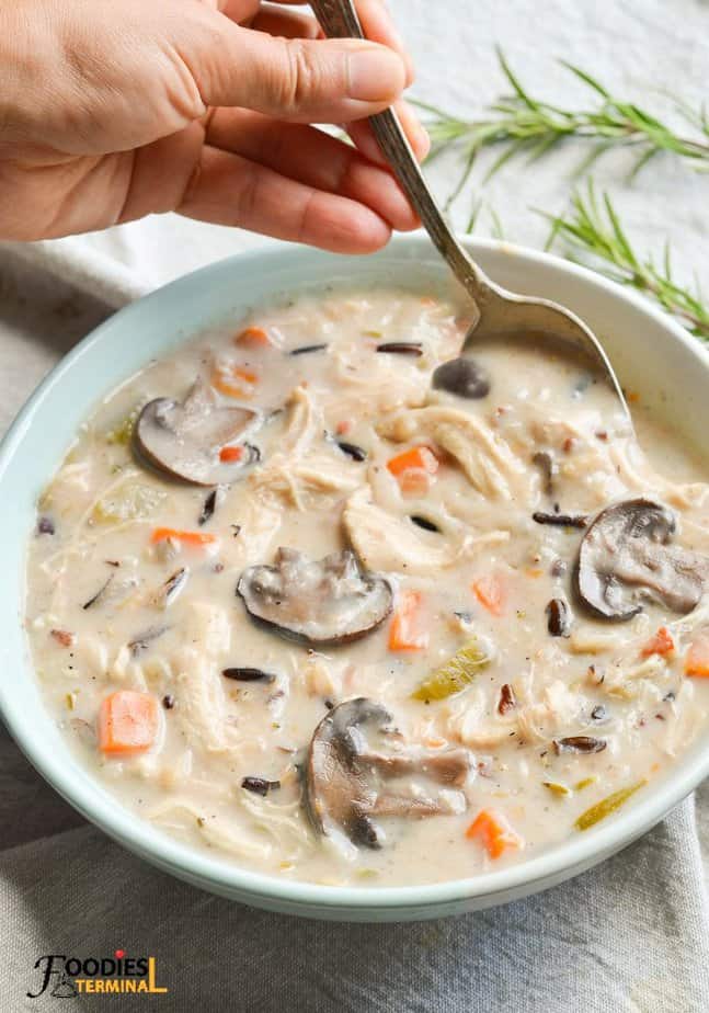 Best chicken wild rice mushroom soup instant pot recipe in a light blue bowl