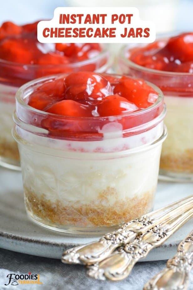 cheesecake in mason jars with cherry pie filling topping