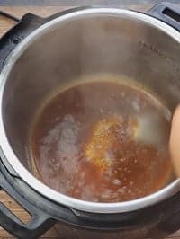 deglazing pot with a steel ladle