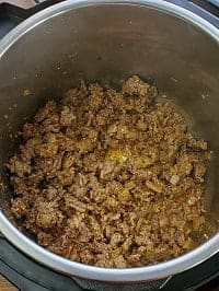 sauteing ground italian sausage with seasoning in instant pot