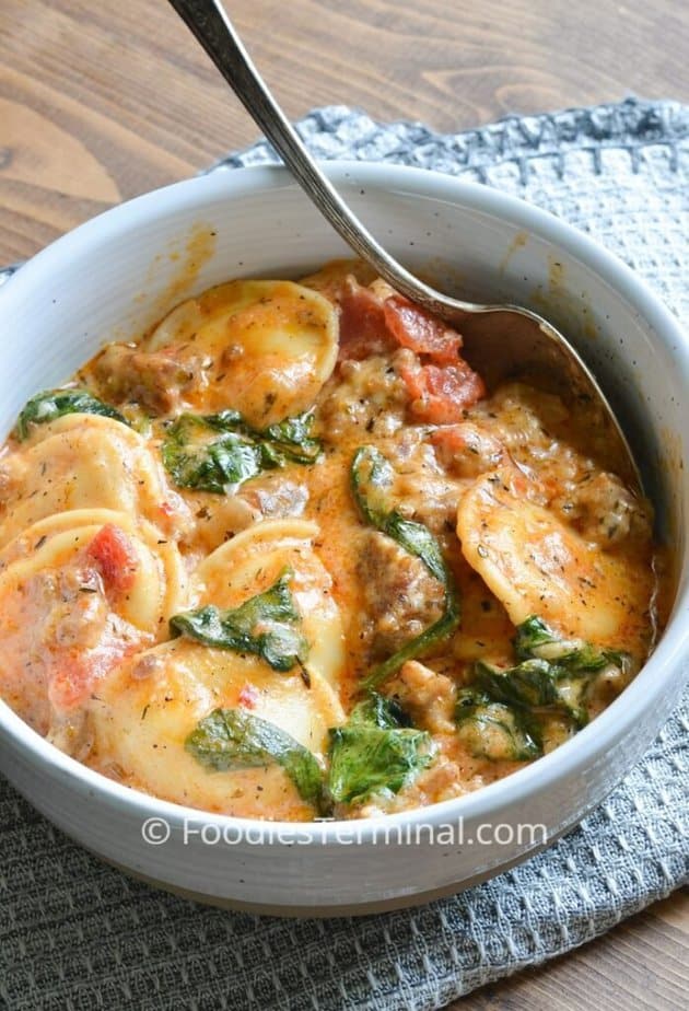 instant pot ravioli in a white bowl with a spoon