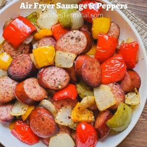 air fryer sausage and peppers in a white plate