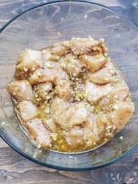 marinated chicken in clear glass bowl