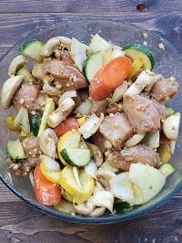 marinated chicken hibachi in glass bowl with veggies