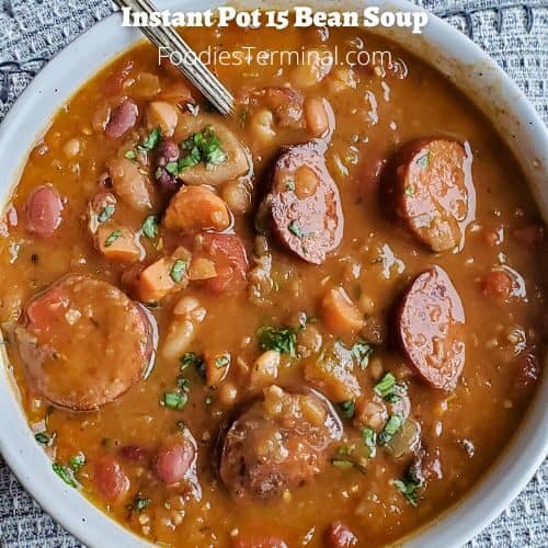 instant pot 15 bean soup in a white bowl with a spoon