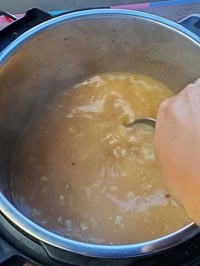 deglazing pot with a steel ladle