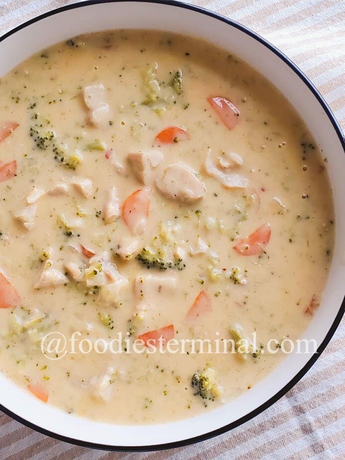 creamy chicken broccoli soup in a white bowl