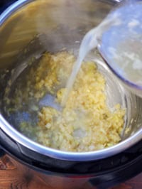 pouring chicken stock in instant pot