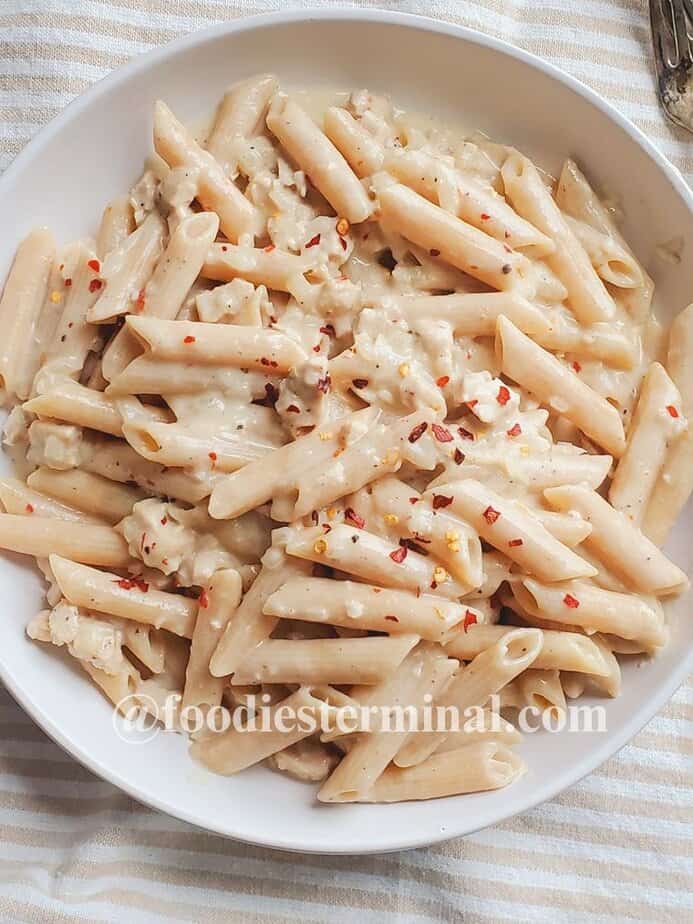 turkey meat pasta in a white plate