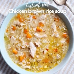 chicken brown rice soup served in a light blue bowl